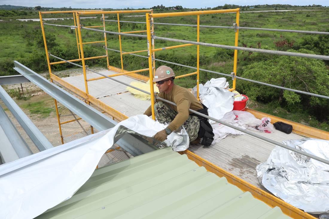 Insulation installer, at work