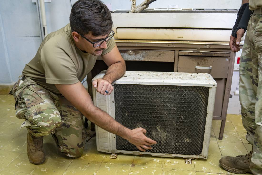 Refrigeration technician, at work