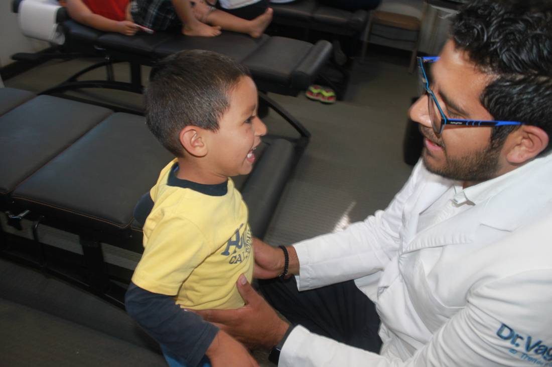 Specialist physician in pediatrics, at work